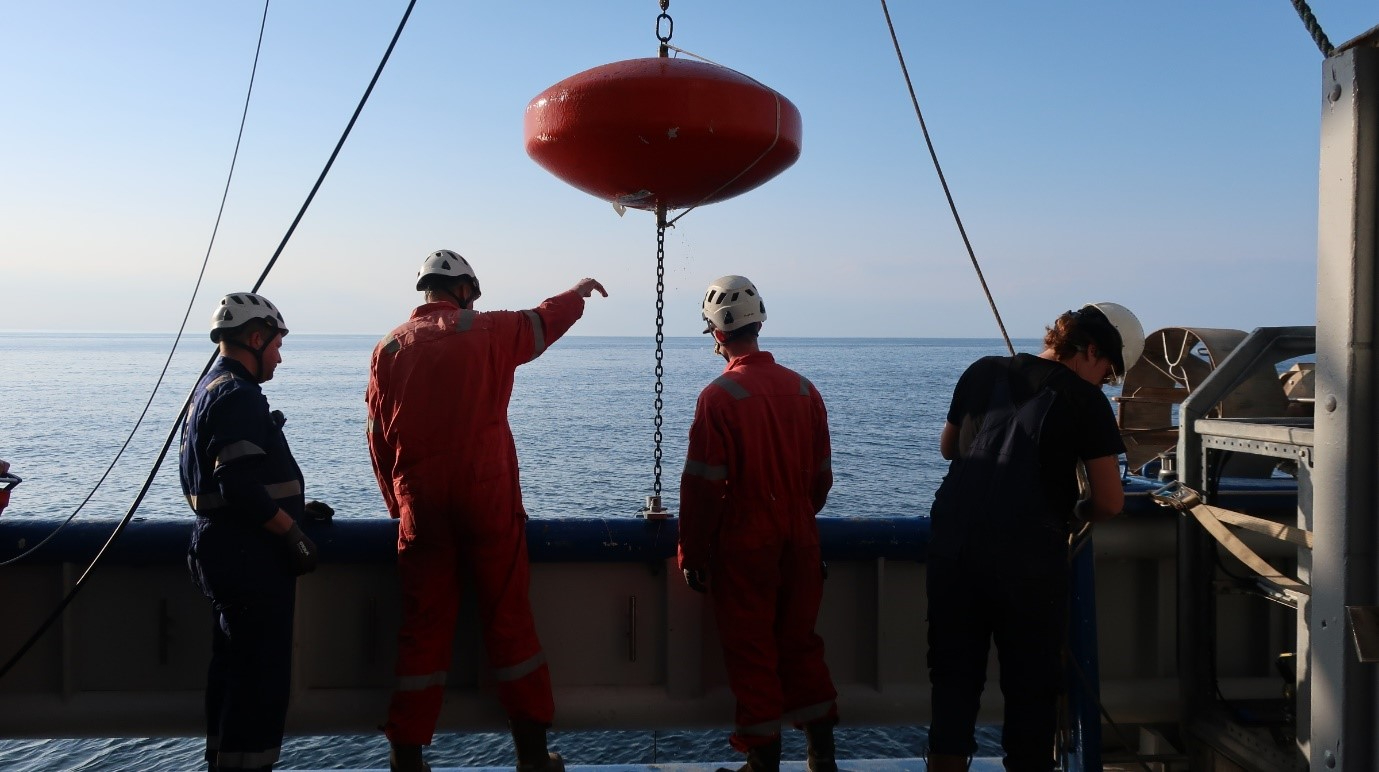 Mooring recovery. On the buoy we have an ADCP attached. The Mooring is recovered meter by meter.