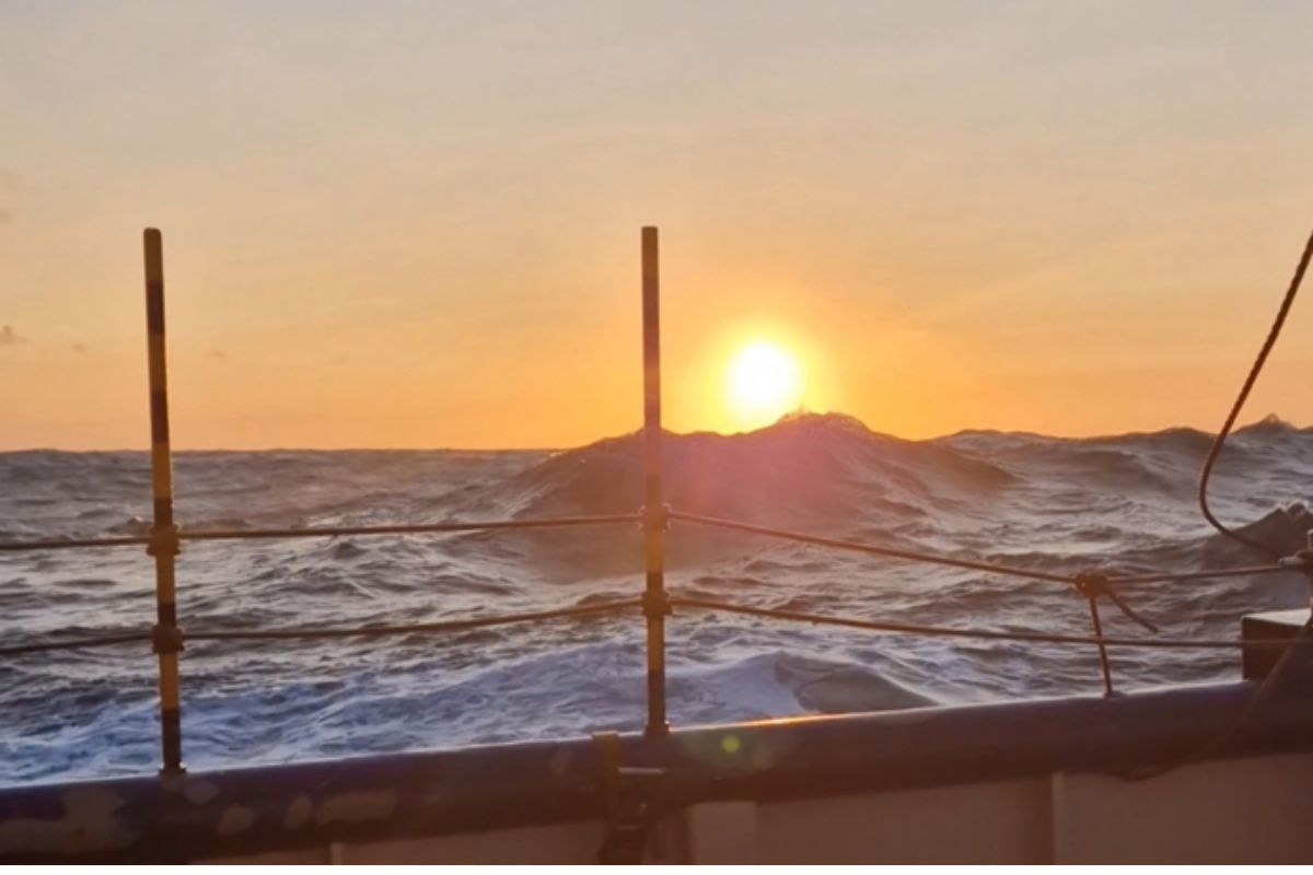 Sunset on our way back to our sampling location, waves hitting the sun in the sky. Photo by: Robin van Dijk